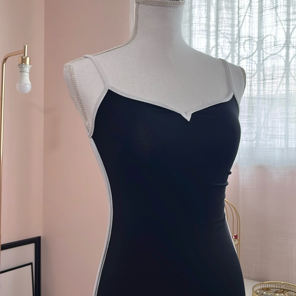 Black bodycon dress and white outline strip